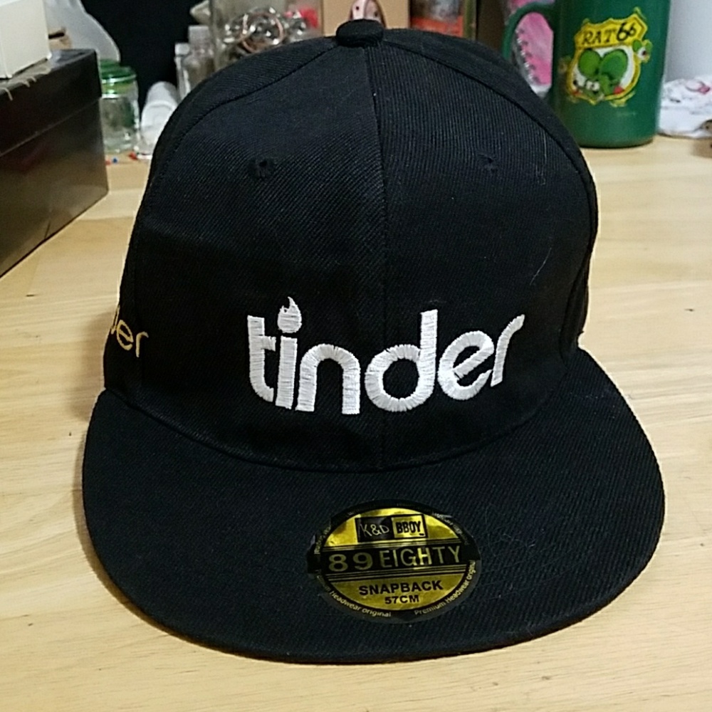 TINDER Surrender staff snap back hat.